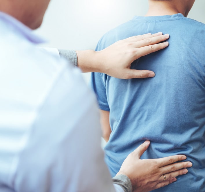 Doctor consulting with patient Back problems